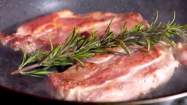 barbecue cutlets look very tasty cooked for a hamburger on a hot open fire on the grill turns over with a spatula after each turn the fire flares up and creates slow motion video for any restaurant.