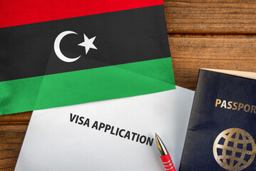 Visa application form, passport and flag of Libya
