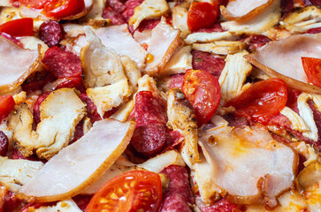 ready pizza ingredients close-up, tomatoes ham sausage