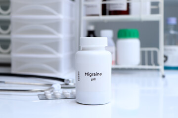 Migraine pill in white bottle, pill stock