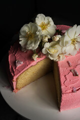 pink vanilla cake with flowers on top