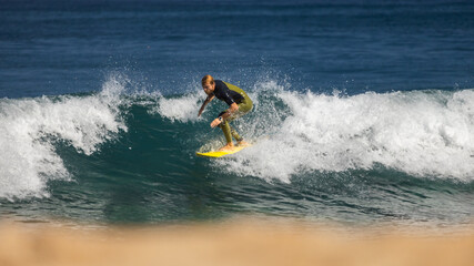 Professional surfer on an ocean wave.