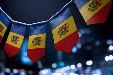 A garland of Moldavia national flags on an abstract blurred background