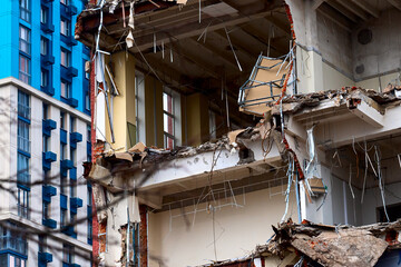 dismantled old building. Half demolished house, dismantling of the old one for the construction of a new building