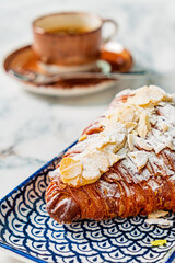 fresh croissant with cup of coffee