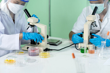 Fototapeta premium Scientist analyzing matter or germ using microscope