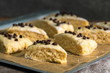 Bakery - Dough for bread or scones is on a parchment paper, prepared for baking.