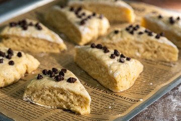 Bakery - Dough for bread or scones is on a parchment paper, prepared for baking.