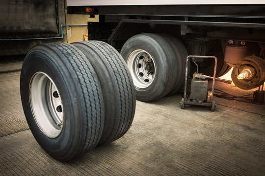 Truck Spare Wheels Tyre Waiting for to Change. Big Truck Wheels Tires. Freight Trucks Cargo Transport. Workshop Auto Service.
