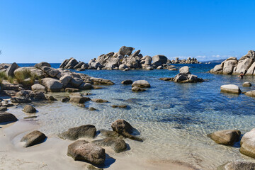 Fototapeta na wymiar Tamaricciu beach, Mediterranean beach dotted with rocks along the coastline, Porto Vecchio, Corsica, France
