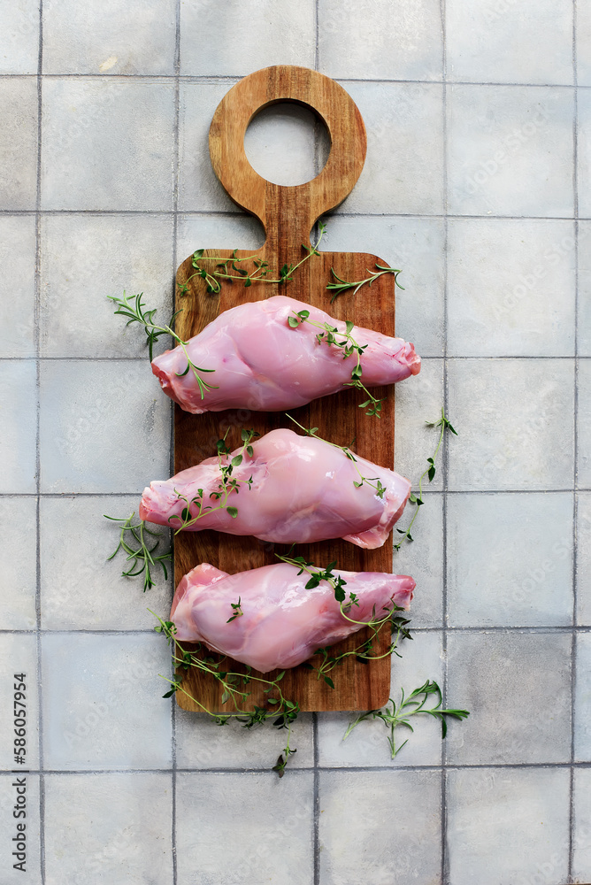 Canvas Prints Raw rabbit legs with fresh herbs.style hugge.