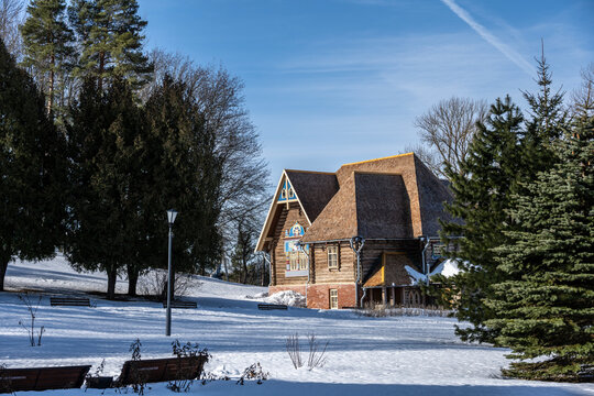 an old wooden manor painted with ancient fairy tale traditions on a sunny winter day in the suburbs of Veliky Novgorod