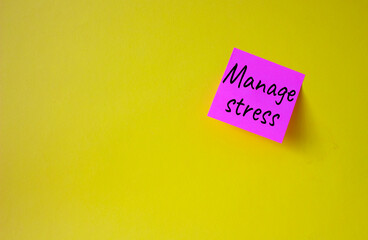 Manage stress symbol. Concept word Manage stress on pink steaky note. Beautiful yellow background. Business and Manage stress concept. Copy space