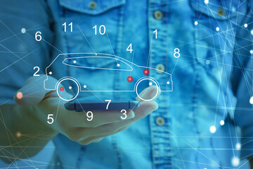 Technology fix car repair on car Lift in garage dealership Fix the car with a touch touching the screen interface point to the point that needs to be corrected New technology in the car industry.