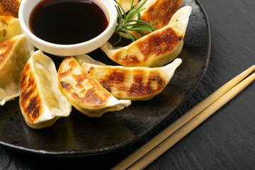 Gyoza Chinese Dumplings on Black Plate, Fried Vegetable Jiaozi Macro, Chicken Momo Pile, Asian...