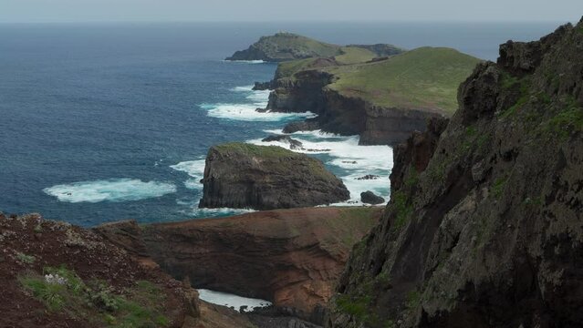 Ocean waves crush on cliffs at Ponta de Sao Lourenco peninsula Madeira, Portugal