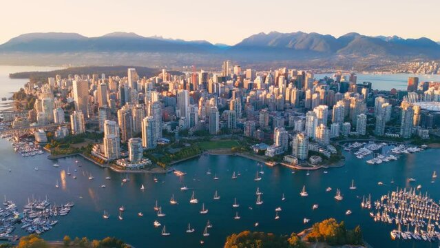 Vancouver downtown skyline aerial flythrough, BC, Canada at sunset