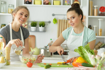 Beautiful teenagers cooking