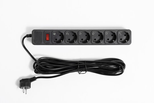 Black Extension Cord With Red Power On Off Button On White Background, Top View.