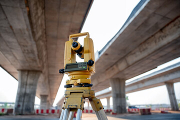Theodolite of a civil engineer surveying the construction of a highway
