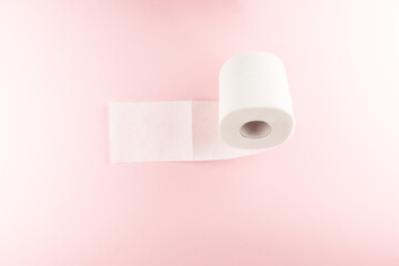 Tissue or toilet paper foroll on pink background with copy space wiping clean. Flat lay and top view image.