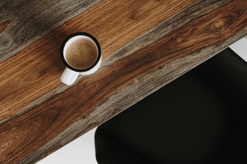 Coffee time! Flatlay mug with coffee with milk on wooden table. Minimalist morning breakfast beverage background. Aesthetic flat lay, top view still life lifestyle concept