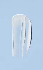 cosmetic smears cream texture on blue background