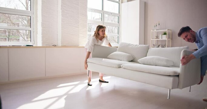 Person Lifting Heavy Furniture Couch Having Back