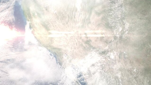 Earth zoom in from outer space to city. Zooming on Kingman, Arizona, USA. The animation continues by zoom out through clouds and atmosphere into space. Images from NASA