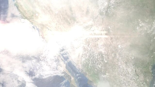 Earth zoom in from outer space to city. Zooming on Nogales, Arizona, USA. The animation continues by zoom out through clouds and atmosphere into space. Images from NASA