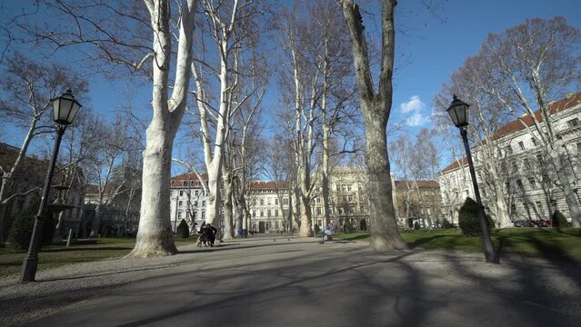 Park Zrinjevac in Zagreb with people walking and enjoying on the benches in the park ai autumn