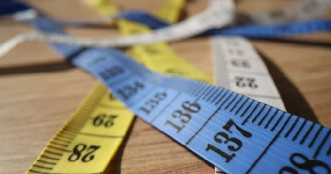 Sewing tapes measure with different metric types on table