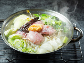 Monkfish Soup , A dish made with monkfish as the main ingredient and boiled with bean sprouts	