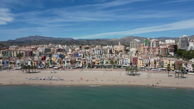 Drone footage coastline and La Vila Joiosa touristic town view from top, sandy beach and Mediterranean seascape.Costa Blanca, Spain.