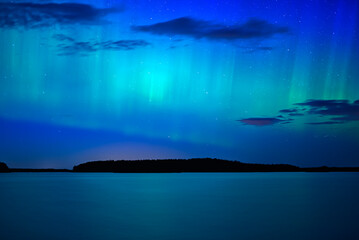 Northern light dancing over the sky in Farnebofjarden national park in north of Sweden.