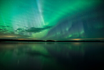 Northern light dancing over the sky in Farnebofjarden national park in north of Sweden.
