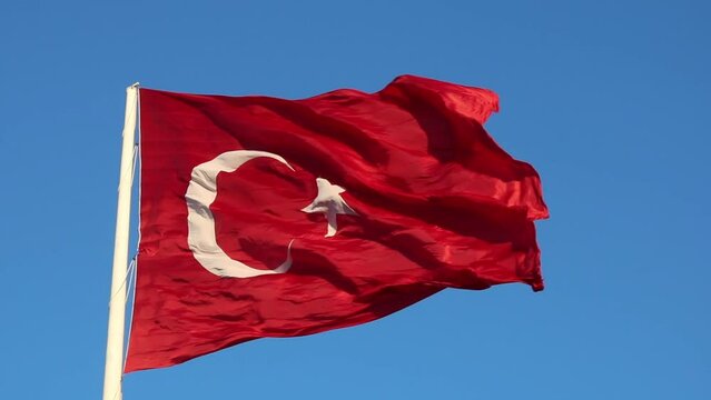 Waving Turkish Flag on blue sky. National holidays of Turkiye fullhd video. 19 mayis or 23 nisan or 15 temmuz or 29 ekim or 30 agustos concept footage.