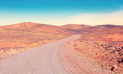 Fototapeta na wymiar African road in desert landscape- Adventure, road trip, Morocco