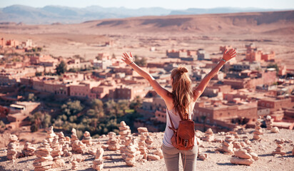 Happy traveler woman in Morocco- Ait ben haddou village panoramic view