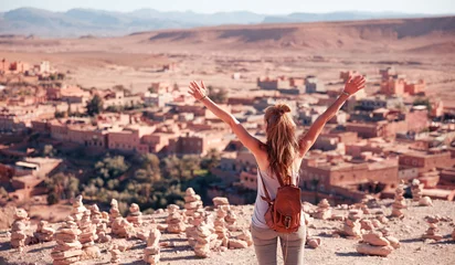 Zelfklevend Fotobehang Happy traveler woman in Morocco- Ait ben haddou village panoramic view © M.studio