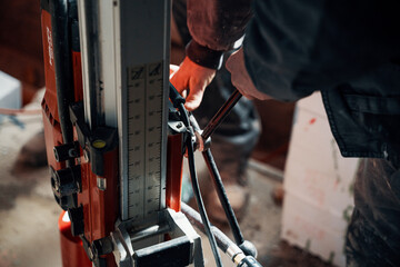 Drilling a hole into a concrete floor with core driller