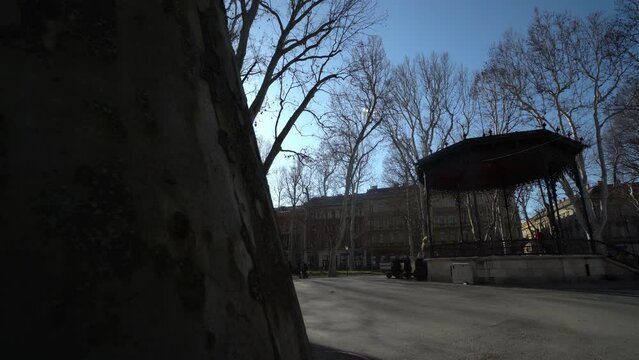 People around pavillion in Zrinjevac park Zagreb. People relaxing on a bench
