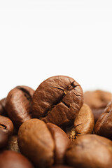 Fototapeta premium Coffee beans on white background. Copy space for text