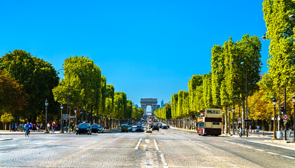 Avenue des Champs Elysees in Paris, France, view towards the Arc de Triomphe and La Defense