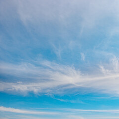 Obraz premium Beautiful white fluffy clouds on bright blue sky.