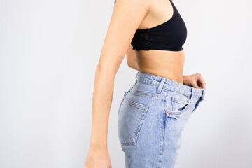 Woman Weight Loss Wearing Old Pair of Jeans Too Big Thin Waist Slim Female Body