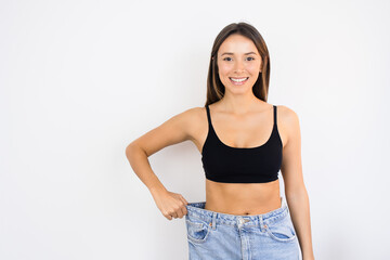 Happy Woman Weight Loss Wearing Old Pair of Jeans Too Big Thin Waist Slim Female Body