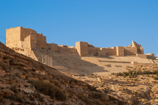 Jordan. Crusader castle El-Karak on mountain against blue December sky.  Majestic and impregnable fortress of El-Karak or "Fortress of Crow" was  built by crusaders in 1162. Stock Photo | Adobe Stock