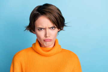 Portrait of unsatisfied offended girl pouted lips sullen face isolated on blue color background