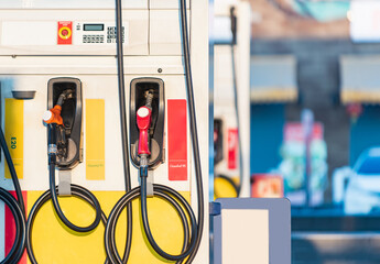 Filling nozzles for gas pump, gas station in operation. Fuel dispenser nozzles in a gas...